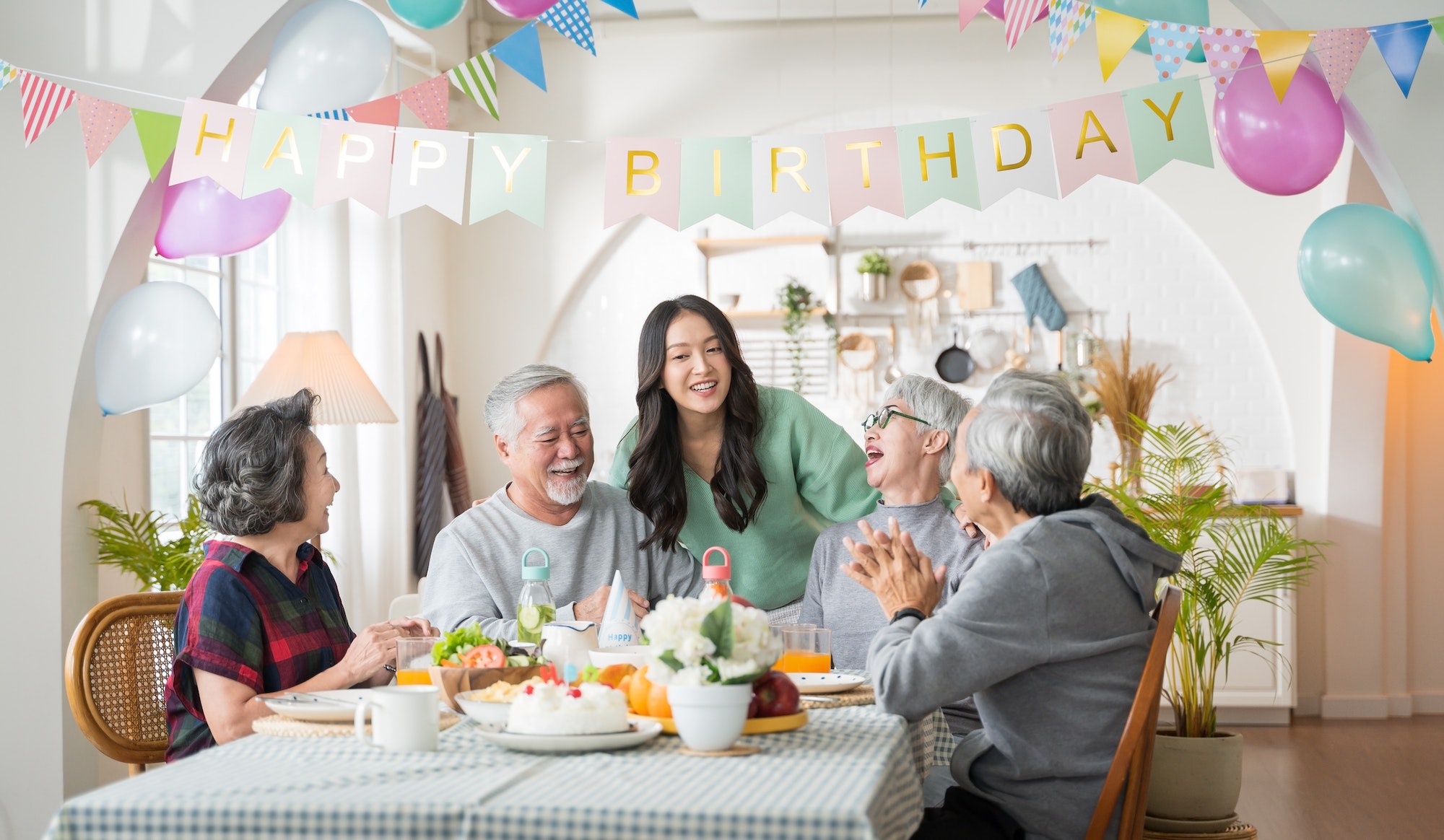 Group of Asian senior people having birthday party at home